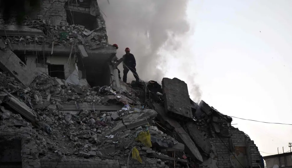 Rescuers extinguish a fire and work in a damaged residential building following missile strikes on the Ukrainian capital of Kyiv on July 2, 2026, amid the Russian invasion of Ukraine. Russian missile and drone strikes rocked Kyiv early on July 2, killing at least eight people and wounding dozens, after President Volodymyr Zelensky warned that Moscow was preparing a "massive attack". (Photo by Genya SAVILOV/AFP)