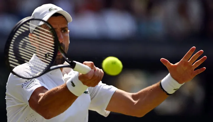 Serbia's Novak Djokovic returns to France's Arthur Rinderknech during their men's singles third round tennis match on the fifth day of the 2026 Wimbledon Championships at The All England Lawn Tennis and Croquet Club in Wimbledon, southwest London, on July 3, 2026. (Photo by Glyn KIRK/AFP)/RESTRICTED TO EDITORIAL USE