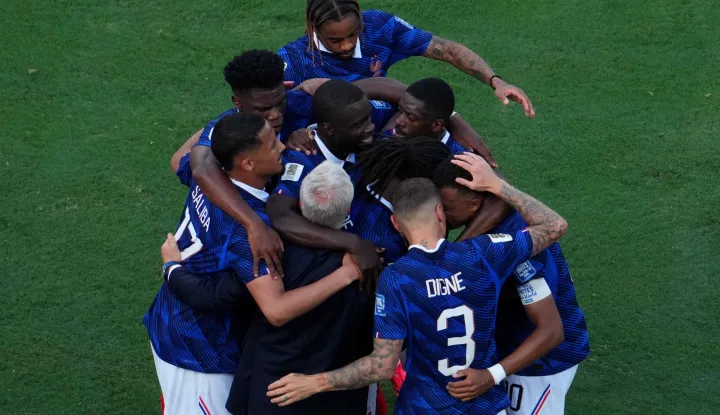 France's forward #10 Kylian Mbappe celebrates scoring his team's first goal with teammates and head coach Didier Deschamps during the 2026 World Cup round of 32 football match between France and Sweden at the New York/New Jersey Stadium in East Rutherford on June 30, 2026. (Photo by TIMOTHY A. CLARY/AFP)