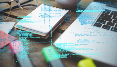digital composite of laptop with notepad and coffee on table with graphics