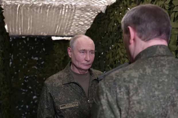 In this grab taken from a handout footage posted of the official website of the Russian presidential press office on July 3, 2026, Russia's President Vladimir Putin is welcomed by Chief of the General Staff Valery Gerasimov as he visits a command post for the joint force grouping, amid the ongoing Russian-Ukrainian conflict. (Photo by Handout/RUSSIAN PRESIDENTIAL PRESS OFFICE/AFP)/RESTRICTED TO EDITORIAL USE - MANDATORY CREDIT "AFP PHOTO/Russian presidential press office" - HANDOUT - NO MARKETING NO ADVERTISING CAMPAIGNS - DISTRIBUTED AS A SERVICE TO CLIENTS