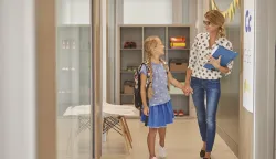 Full length of student and teacher 