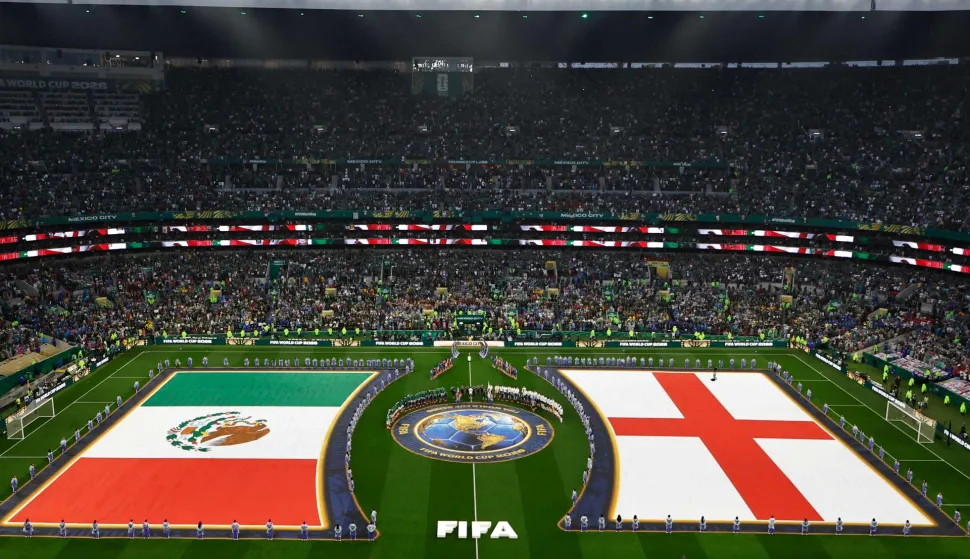 Mexico and England players stand for the national anthems ahead of the 2026 World Cup round of 16 football match between Mexico and England at the Mexico City Stadium in Mexico City on July 5, 2026. (Photo by ULISES RUIZ/AFP)