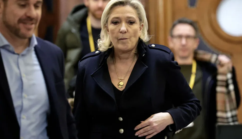 (FILES) President of the parliamentary group of the French far-right Rassemblement National (RN) party, Marine Le Pen leaves during a break during her appeal trial on charges of embezzlement of European public funds in a case of alleged European Parliament fake jobs in Paris the Palais de Justice de Paris on January 21, 2026. Marine Le Pen was sentenced at first instance to a five-year ban on standing for election, effective immediately, after being convicted of embezzlement in the case involving the National Front?s (the former name of the RN) European Parliament assistants. She faces the same penalty on appeal. Should the sentence be upheld on July 7, 2026 she would be ineligible to run for office. In that case, Jordan Bardella, president of the RN and widely regarded as her heir apparent, would lead the party?s campaign in the election. (Photo by STEPHANE DE SAKUTIN/AFP)