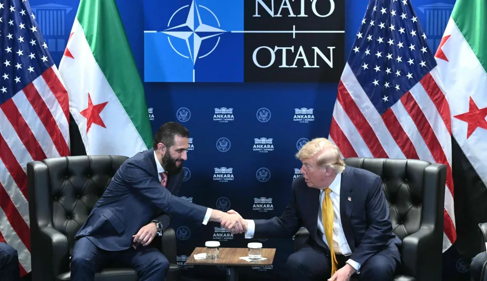 US President Donald Trump meets Syrian President Ahmed al-Sharaa (L) on the sidelines of the NATO Summit at Bestepe Presidential Compound in Ankara, on July 8, 2026. The summit comes at a fraught time for the 77-year-old transatlantic alliance, with the US President demanding members make good on a pledge to ramp up defence spending as Washington takes a step back from Europe. (Photo by SAUL LOEB/AFP)