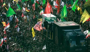 TOPSHOT - Crowds of mourners gather around an unseen vehicle transporting the coffin of Iran's slain supreme leader Ali Khamenei during a funeral procession in Najaf on July 8, 2026. Funeral processions carrying the coffin of Iran's slain supreme leader Ali Khamenei will pass on July 8 through Iraq's holy cities of Najaf and Karbala, home to Shia Islam's most sacred shrines. (Photo by Murtaja LATEEF/AFP)