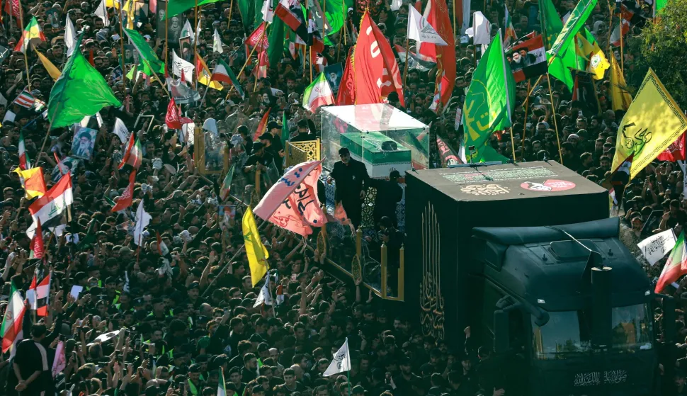 TOPSHOT - Crowds of mourners gather around an unseen vehicle transporting the coffin of Iran's slain supreme leader Ali Khamenei during a funeral procession in Najaf on July 8, 2026. Funeral processions carrying the coffin of Iran's slain supreme leader Ali Khamenei will pass on July 8 through Iraq's holy cities of Najaf and Karbala, home to Shia Islam's most sacred shrines. (Photo by Murtaja LATEEF/AFP)