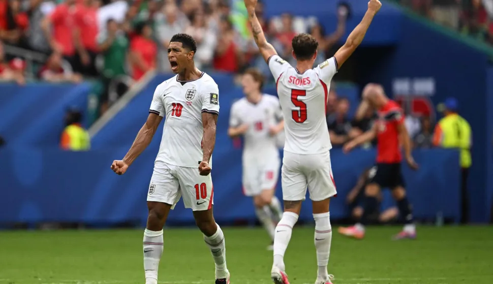 England's midfielder #10 Jude Bellingham celebrates scoring his team's first goal during the 2026 World Cup football tournament quarter-final match between Norway and England at Miami Stadium in Miami Gardens on July 11, 2026. (Photo by MAURO PIMENTEL/AFP)