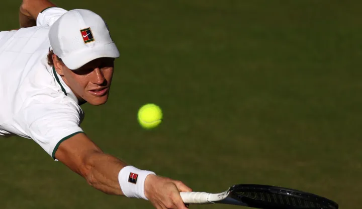 Italy's Jannik Sinner returns to Germany's Alexander Zverev during their men's singles final tennis match on the fourteenth day of the 2026 Wimbledon Championships at The All England Lawn Tennis and Croquet Club in Wimbledon, southwest London, on July 12, 2026. (Photo by Adrian Dennis/AFP)/RESTRICTED TO EDITORIAL USE