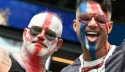 England fans cheer for their team before the start of the 2026 World Cup football tournament quarter-final match between Norway and England at Miami Stadium in Miami on July 11, 2026. (Photo by ROBERTO SCHMIDT/AFP)