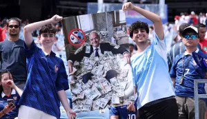 FOXBOROUGH, MASSACHUSETTS - JULY 09: Fans pose with a poster featuring the likes of FIFA President Gianni Infantino before the FIFA World Cup 2026 Quarter Final match between France and Morocco at Boston Stadium on July 09, 2026 in Foxborough, Massachusetts. Lars Baron/Getty Images/AFP (Photo by Lars Baron/GETTY IMAGES NORTH AMERICA/Getty Images via AFP)