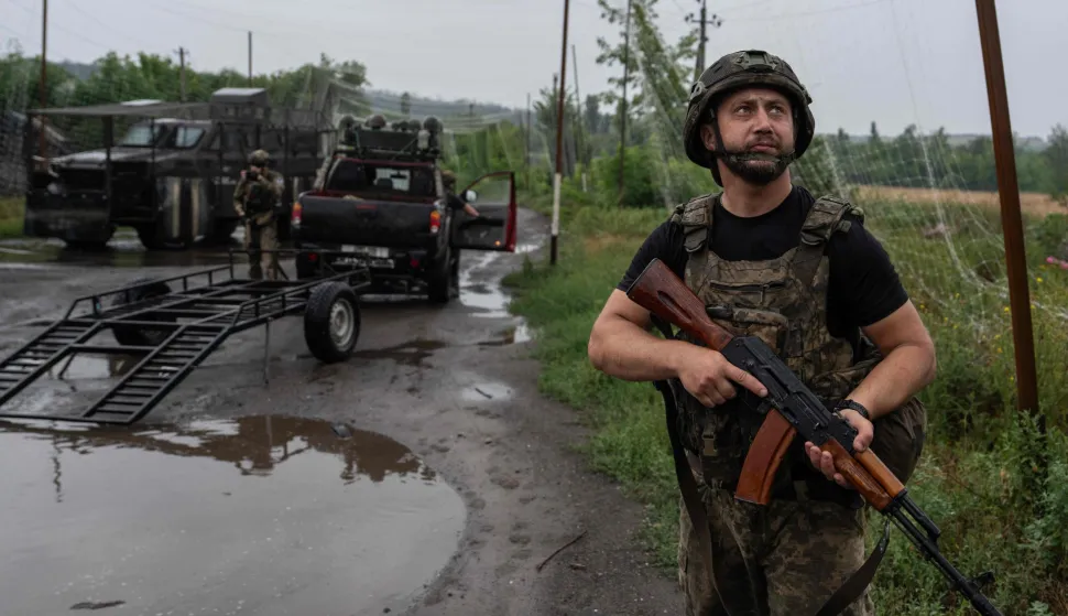 This handout photograph taken on July 10, 2026 and released on july 11, 2026 shows servicemen of the Alter Ego battalion, 93rd Kholodnyi Yar Separate Mechanized Brigade, unloading a UGV loaded with ammunition, water, and provisions in Druzhkivka, Donetsk region, amid Russian invasion in Ukraine. According to the Ministry of Defense of Ukraine, in June 2026 UGV completed a record 16,676 missions, which is 122% more than at the beginning of the year. (Photo by Iryna Rybakova/Press service of the 93rd Kholodnyi Yar Separate Mechanised Brigade/AFP)