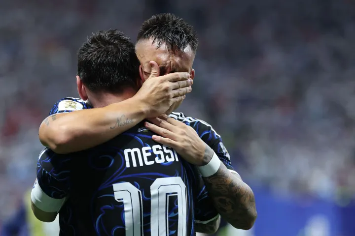 Argentina's forward #22 Lautaro Martinez celebrates with Argentina's forward #10 Lionel Messi scoring his team's second goal during the 2026 World Cup football tournament semi-final match between England and Argentina at the Atlanta Stadium in Atlanta on July 15, 2026. (Photo by Thomas COEX/AFP)