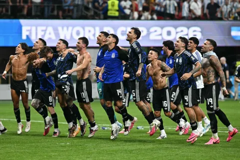 Argentina's players celebrate with fans after winning the 2026 World Cup football tournament semi-final match between England and Argentina at the Atlanta Stadium in Atlanta on July 15, 2026. (Photo by Paul ELLIS/AFP)