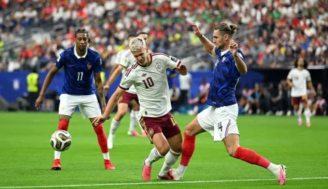 ARLINGTON, TEXAS - JULY 14: Dani Olmo #10 of Spain is fouled by Adrien Rabiot #14 of France during the FIFA World Cup 2026 Semi Final match between France and Spain at Dallas Stadium on July 14, 2026 in Arlington, Texas. Shaun Botterill/Getty Images/AFP (Photo by Shaun Botterill/GETTY IMAGES NORTH AMERICA/Getty Images via AFP)