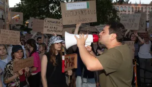 A man seen shouting into a megaphone with protesters holding signs demanding accountability for the dismissal of Defence Minister Mikhail Fedorov. Protests entered their second day in major Ukrainian cities as citizens and military veterans demanded the reinstatement of the dismissed Defense Minister, Mykhailo Fedorov. Demonstrators, chanting "Fedorov = Victory," criticized government personnel reshuffles and called for the resignation of the Armed Forces Commander-in-Chief. The dismissal, approved by the Verkhovna Rada, follows President Zelenskyy's statement about ongoing friction between the Ministry and the military leadership over mobilization and equipment issues. (Photo by Mykhaylo Palinchak/SOPA Images/Sipa USA) Photo: SOPA Images/SIPA USA