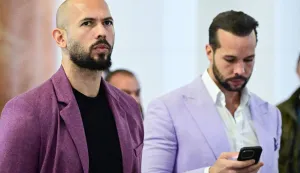 (FILES) Andrew Tate (L) and his brother Tristan Tate are pictured inside The Court of Appeal in Bucharest, Romania, on December 10, 2024. Radical social media influencer Andrew Tate and his brother Tristan were arrested on July 18, 2026 in Miami, the US Marshals Service told AFP, with news outlet TMZ posting video of officers placing the men in custody. The UK Crown Prosecution Service said in a statement UK prosecutors will be seeking the brothers' extradition in relation to charges including rape, trafficking and assault. (Photo by Daniel MIHAILESCU/AFP)