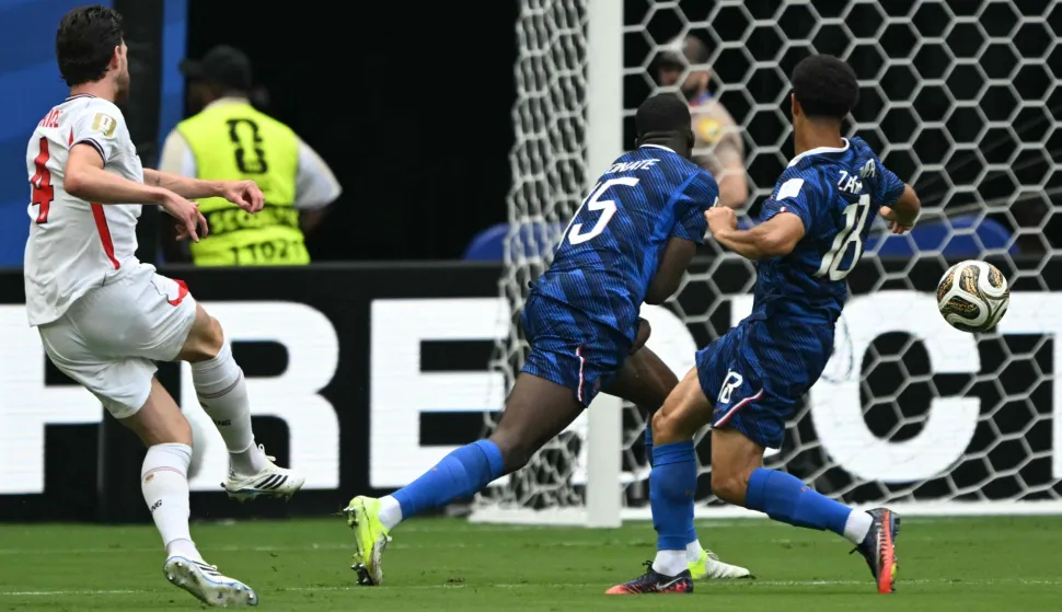 England's midfielder #04 Declan Rice scores his team's first goal during the 2026 World Cup football tournament third-place match between France and England at the Miami Stadium in Miami on July 18, 2026. (Photo by ROBERTO SCHMIDT/AFP)