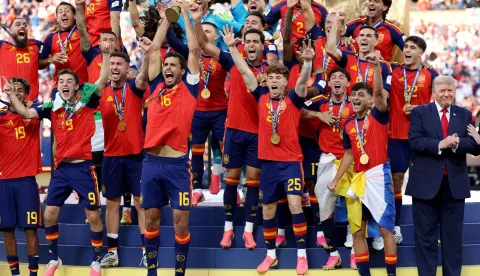 EAST RUTHERFORD, NEW JERSEY - JULY 19: Rodri #16 of Spain lifts the FIFA World Cup Winner?s Trophy alongside U.S. President Donald Trump after the team?s victory following during the FIFA World Cup 2026 Final match between Spain and Argentina at New York New Jersey Stadium on July 19, 2026 in East Rutherford, New Jersey. Carl Recine/Getty Images/AFP (Photo by Carl Recine/GETTY IMAGES NORTH AMERICA/Getty Images via AFP)