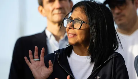 (FILES) Venezuela's interim President Delcy Rodriguez gestures as she visits a temporary camp of the French Civil Security in La Guaira, La Guaira state, on July 1, 2026, following the June 24 twin earthquakes in Venezuela. Venezuela's interim President, Delcy Rodriguez, announced on television on July 8, that she had written to King Charles III of England to request the release of some 30 tonnes of Venezuelan gold frozen in the United Kingdom as part of sanctions against the country, so that it could be used to help rebuild the country following the twin earthquakes. (Photo by Miguel MEDINA/POOL/AFP)