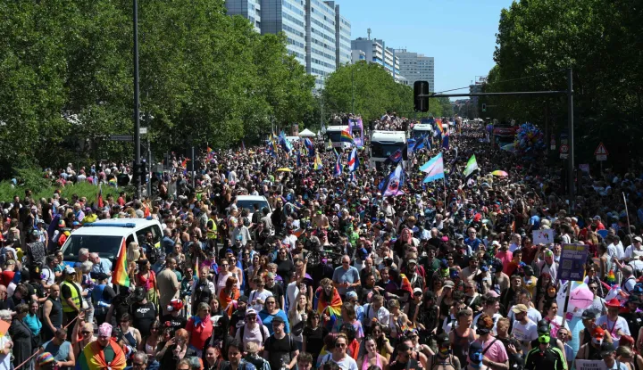 Participants march during the Christopher Street Day (CSD) parade along Leipziger Strasse in Berlin on July 25, 2026. This year's CSD parade takes place under the slogan 'Taking a stand is Hot', where various groups will demonstrate in support of diversity, human rights, and the protection of minorities. (Photo by RALF HIRSCHBERGER/AFP)