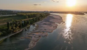 This aerial view shows sandbars appearing in the shallow water of the Danube River near Novi Sad, Serbia, on July 27, 2026. Scientists say global warming is increasing droughts and causing weather emergencies to become more extreme and more frequent. Prolonged drought and hot weather across Europe have pushed water levels along the Danube river to record seasonal lows, reaching its lowest flow rate in the last 30 years. (Photo by Nenad MIHAJLOVIC/AFP)