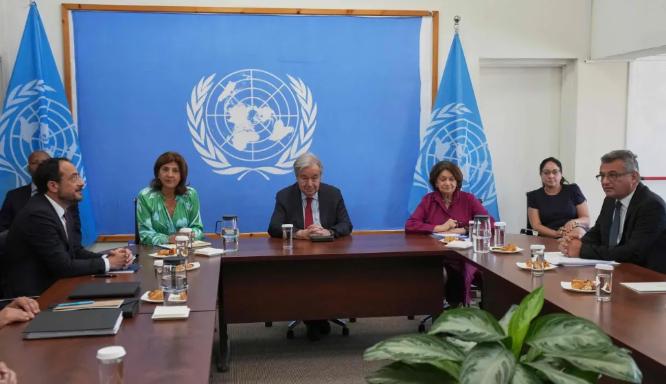 Cyprus' President Nikos Christodoulides (L), United Nations Secretary-General Antonio Guterres (C) and and Turkish-Cypriot leader Tufan Erhurman (R) hold a meeting at a UN compound in the Nicosia airport area, inside the United Nations-controlled buffer zone in the divided capital of Nicosia, Cyprus, on July 29, 2026. UN chief Antonio Guterres said he held "very constructive" separate meetings with rival Cypriot leaders on July 28, ahead of trilateral meetings to weigh the prospect of fresh negotiations nine years after the peace process collapsed. With less than six months until the end of his term in office, Guterres flew to the divided Mediterranean island on the first visit by a UN secretary general since Ban Ki-moon's visit in 2010. (Photo by Petros Karadjias/POOL/AFP)
