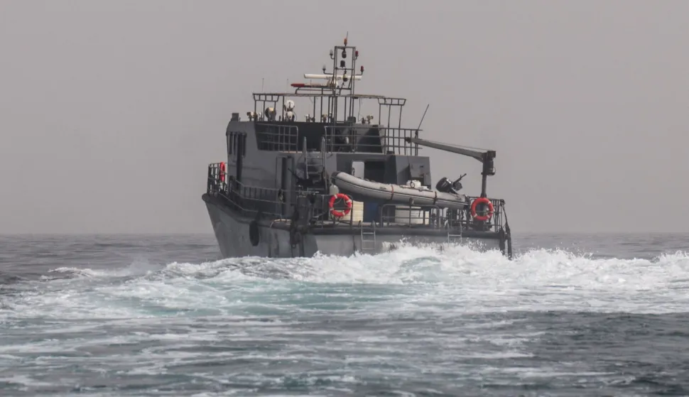 A vessel of the navy of Yemen's Aden-based internationally recognised government patrols a shipping lane off Hanish Island in the Red Sea on July 27, 2026. A Houthi spokesman said on July 24 that the rebels were not blocking traffic through the strategic Bab al-Mandeb Strait, after they declared a maritime embargo this week on their foe Saudi Arabia. The Iran-backed group attacked a Saudi ship in the nearby Red Sea after announcing the blockade, which threatens the top oil exporter's ability to get its supplies to the world following Iran's parallel blockade of the Strait of Hormuz, the kingdom's only other maritime route. (Photo by Khaled ZIAD/AFP)/