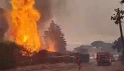 This screengrab from a video posted on the X account of Spain's Military Emergencies Unit UME (@UMEgob) on July 23, 2026, shows UME personnel fighting a wildfire in San Mart?n de Valdeiglesias, Madrid. In Spain, a fire broke out on July 22 afternoon in Almorox, near Toledo, southwest of Madrid, leading to the evacuation of several municipalities in the area and the lockdown of one of them, emergency services announced on X. Reflecting the rapid spread of the fire, authorities and emergency services twice sent an alert message to all mobile phones in the area to warn of the situation. (Photo by Handout/X account of Spain's Military Emergencies Unit UME (@UMEgob)/AFP)/RESTRICTED TO EDITORIAL USE - MANDATORY CREDIT "AFP PHOTO/X account of Spain's Military Emergencies Unit UME (@UMEgob)/HANDOUT" - NO MARKETING NO ADVERTISING CAMPAIGNS - DISTRIBUTED AS A SERVICE TO CLIENTS