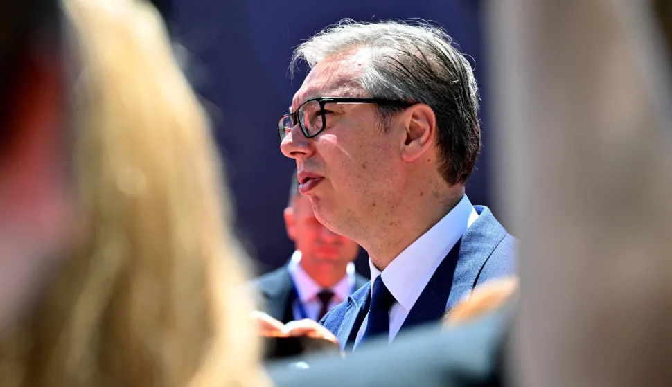 Serbia's President Aleksandar Vucic walks through a crowd of journalists as he arrives at an EU-Western Balkans Summit at Porto Montenegro in Tivat on June 5, 2026. (Photo by ELVIS BARUKCIC/AFP)