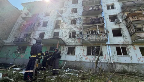 Ukrainian rescuers work at a damaged residential building at the site of a Russian airstrike in Zaporizhzhia on August 10, 2026, amid the Russian invasion of Ukraine. (Photo by Darya NAZAROVA/AFP)