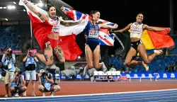 TOPSHOT - (From L) Silver medallist Poland's Ewa Swoboda, gold medallist Britain's Amy Hunt and Belgium's Delphine Nkansa celebrate after competing in the women's 100m final during the European Athletics Championships at Alexander Stadium in Birmingham on August 10, 2026. (Photo by Paul ELLIS/AFP)