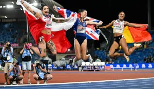 TOPSHOT - (From L) Silver medallist Poland's Ewa Swoboda, gold medallist Britain's Amy Hunt and Belgium's Delphine Nkansa celebrate after competing in the women's 100m final during the European Athletics Championships at Alexander Stadium in Birmingham on August 10, 2026. (Photo by Paul ELLIS/AFP)