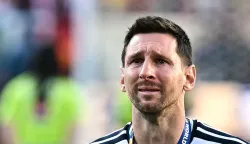 (FILES) Argentina's forward #10 Lionel Messi cries during the trophy ceremony at the end of the 2026 World Cup football tournament final match between Spain and Argentina at the New York/New Jersey Stadium in East Rutherford on July 19, 2026. On August 12, 2026, Argentine football star Lionel Messi said he has ?serious doubts? about whether he will continue playing soccer ?for much longer,? in an emotional farewell letter on Wednesday to his father and agent, Jorge Messi, who died on August 7 at the age of 68. (Photo by Paul ELLIS/AFP)