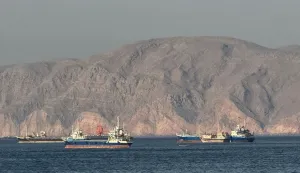 (FILES) Vessels are seen anchored in the Strait of Hormuz, off the port city of Khasab on Oman?s northern Musandam Peninsula on May 17, 2026. For 115 days, captain Mohammad Shafiqul Islam was stranded in the high seas of the Gulf, watching missiles light up the night sky and rationing food and water for his crew. "I tried to stay calm because I was responsible for 31 lives, a ship worth  million and cargo valued at .2 million," the 51-year-old Bangladeshi mariner told AFP, back home after the ordeal. (Photo by AFP)/