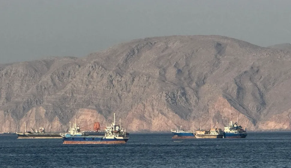 (FILES) Vessels are seen anchored in the Strait of Hormuz, off the port city of Khasab on Oman?s northern Musandam Peninsula on May 17, 2026. For 115 days, captain Mohammad Shafiqul Islam was stranded in the high seas of the Gulf, watching missiles light up the night sky and rationing food and water for his crew. "I tried to stay calm because I was responsible for 31 lives, a ship worth $40 million and cargo valued at $8.2 million," the 51-year-old Bangladeshi mariner told AFP, back home after the ordeal. (Photo by AFP)/