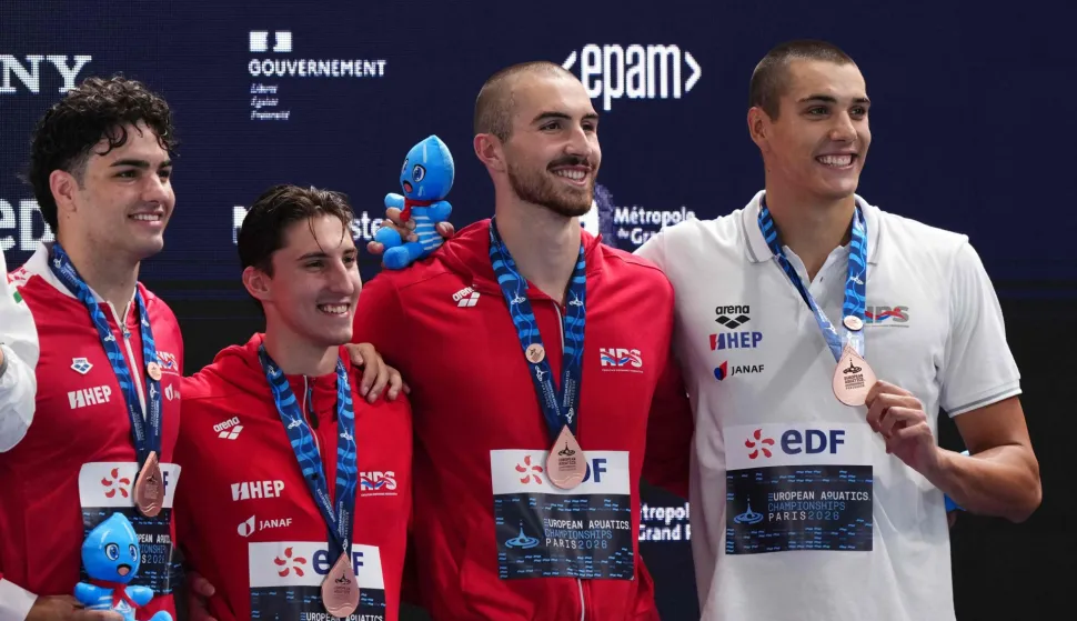 Members of team Croatia pose with their bronze medal on the podium of the men's 4x100m freestyle relay swimming event during the LEN European Aquatics Championships at the Olympic Aquatic Centre in Saint-Denis, northern suburbs of Paris, on August 13, 2026. (Photo by Dimitar DILKOFF/AFP)