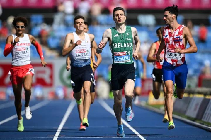 Ireland's Mark English (2nd R) crosses the finish line to arrive first in the men's 800m heat 1 during the European Athletics Championships at Alexander Stadium in Birmingham on August 10, 2026. (Photo by Paul ELLIS/AFP)