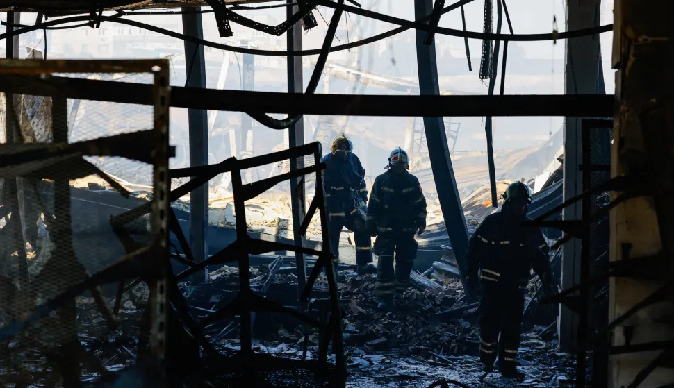 Firefighters work at a burnt-out hypermarket following an overnight Ukrainian drone strike, in the course of the Russia-Ukraine conflict in Donetsk, a Russian-controlled city of Ukraine, August 16, 2026. REUTERS/Alexander Ermochenko Photo: Alexander Ermochenko/REUTERS