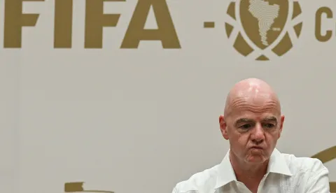 (FILES) FIFA President Gianni Infantino gestures during his visit to the new Concentration Hotel of the Colombian Football Federation in Barranquilla, Colombia, on February 24, 2026. FIFA president Gianni Infantino came under renewed fire on August 10, 2026 as a joint letter from three confederations -- UEFA, CONCACAF and AFC -- declared football "belongs to no individual". (Photo by David SALAZAR/AFP)