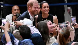 (FILES) Britain's Prince Harry, Duke of Sussex, and his wife Meghan, Duchess of Sussex, meet people at the Royal Children's Hospital in Melbourne, Australia, on April 14, 2026. Prince Harry and his wife Meghan, who cut ties with the British royal family in 2020, are moving back to the United Kingdom, British press reported on August 19, 2026. In a surprise move, the youngest son of King Charles III and Meghan, "plan to leave the United States by the end of the month to settle in a private, non-royal residence, which is said to be located outside London," The Telegraph said. (Photo by William WEST/AFP)