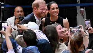 (FILES) Britain's Prince Harry, Duke of Sussex, and his wife Meghan, Duchess of Sussex, meet people at the Royal Children's Hospital in Melbourne, Australia, on April 14, 2026. Prince Harry and his wife Meghan, who cut ties with the British royal family in 2020, are moving back to the United Kingdom, British press reported on August 19, 2026. In a surprise move, the youngest son of King Charles III and Meghan, "plan to leave the United States by the end of the month to settle in a private, non-royal residence, which is said to be located outside London," The Telegraph said. (Photo by William WEST/AFP)