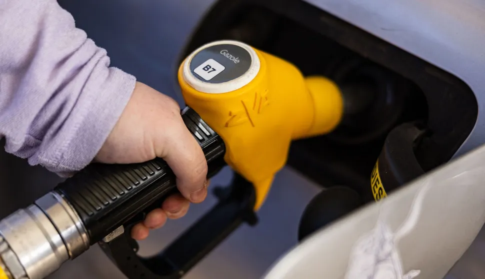 (FILES) A man fills up his car with gazole at an Esso petrol station in Rely, northern France on March 5, 2026. Diesel prices have fallen back below ?2 per litre in France, France's Ministry of the Economy announced on June 15, 2026. (Photo by Sameer Al-DOUMY/AFP)