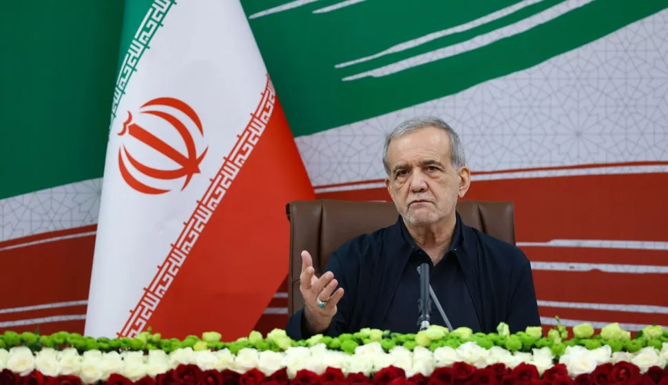 A handout photo made available by the Iranian Presidential Office shows Iran's President Masoud Pezeshkian gesturing as he speaks during a press conference in the capital Tehran, on August 8, 2026. Oman said on August 8, that negotiations with Iran about the future administration of the Strait of Hormuz were "positive and constructive", but warned against repeated attacks on shipping as Tehran pressed its blockade of the vital waterway. (Photo by Iranian Presidential Office/AFP)/