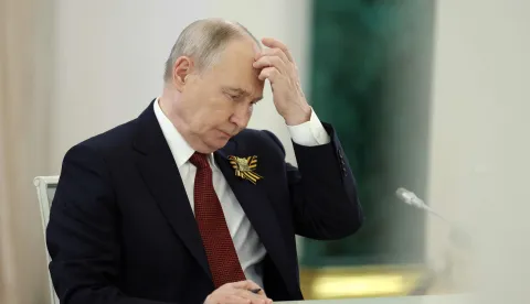 TOPSHOT - Russian President Vladimir Putin attends a meeting with Laotian President at the Kremlin in Moscow on May 9, 2026. (Photo by Ramil Sitdikov/POOL/AFP)