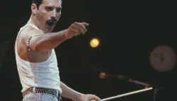 File photo dated 13/7/1985 of Freddie Mercury, of the pop band Queen, performing on stage during the Live Aid concert. British rock legends Queen have made history by becoming the first album to surpass seven million UK chart sales. The record was broken by Queen's Greatest Hits album, recorded in 1981, which includes classic tracks such as We Will Rock You, Don't Stop Me Now and Bohemian Rhapsody. Issue date: Tuesday July 19, 2022. Photo: PA/PRESS ASSOCIATION