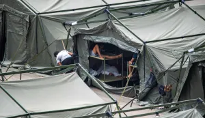 Temporary shelters for migrants are pictured Loma Colmenar district of Ceuta on August 27, 2026. Twelve Moroccan nationals were arrested in Spain's north African enclave Ceuta on Thursday after a night of unrest fuelled by migrant tensions saw a military vehicle carrying Spanish soldiers pelted by stones, leaving one injured.The unrest came as tensions remain high in the tiny enclave of around 80,000 people, nearly a month after more than 70,000 migrants entered from Morocco by swimming or walking in just days. (Photo by Antonio Sempere/AFP)