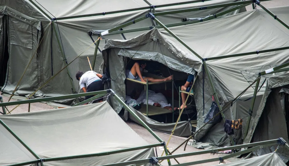 Temporary shelters for migrants are pictured Loma Colmenar district of Ceuta on August 27, 2026. Twelve Moroccan nationals were arrested in Spain's north African enclave Ceuta on Thursday after a night of unrest fuelled by migrant tensions saw a military vehicle carrying Spanish soldiers pelted by stones, leaving one injured.The unrest came as tensions remain high in the tiny enclave of around 80,000 people, nearly a month after more than 70,000 migrants entered from Morocco by swimming or walking in just days. (Photo by Antonio Sempere/AFP)