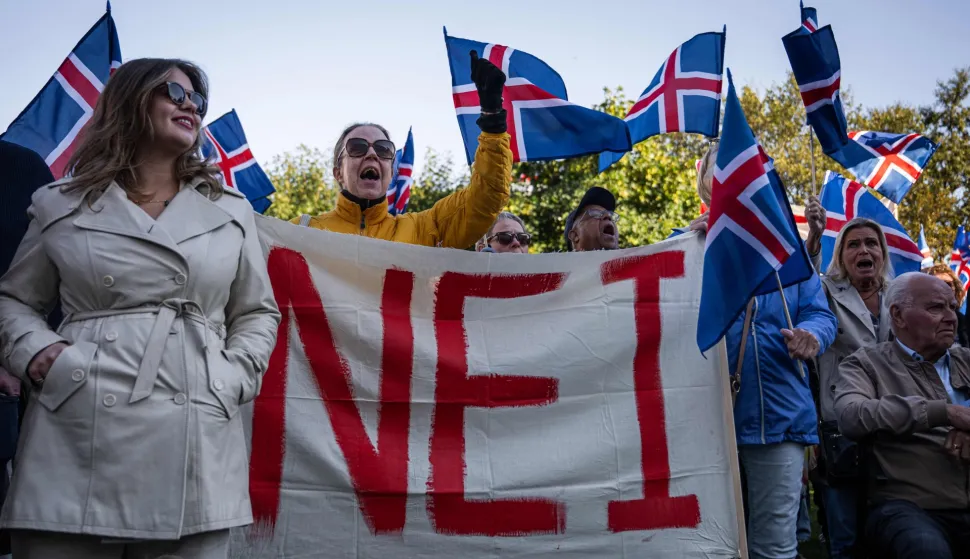 Supporters of the 'No' campaign display a banner during a rally against reopening Iceland's European Union accession negotiations in Reykjavik, Iceland, on August 27, 2026, two days ahead of a national referendum. Icelanders will vote on August 29 on whether the country should resume EU accession negotiations, which were suspended in 2013. The referendum does not decide EU membership, with any eventual accession agreement requiring a second public vote. (Photo by Jonathan NACKSTRAND/AFP)