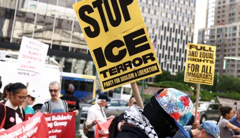 A person holds a sign reading "Stop ICE terror" as people rally during a protest against the termination of Temporary Protected Status (TPS) for the Haitian community and to end mass deportations, at Foley Square in New York City on August 28, 2026. The Supreme Court said in late June 2026 that the Trump administration is allowed to end Temporary Protected Status (TPS) for Haitians and some 6,000 Syrians without judicial review, although the impact of the decision could apply to migrants from many other backgrounds. An estimated 350,000 Haitians live in the United States under the program, with many working in healthcare and construction. (Photo by CHARLY TRIBALLEAU/AFP)